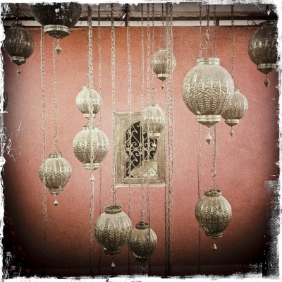 Metal Lanterns hanging in front of metal framed window
